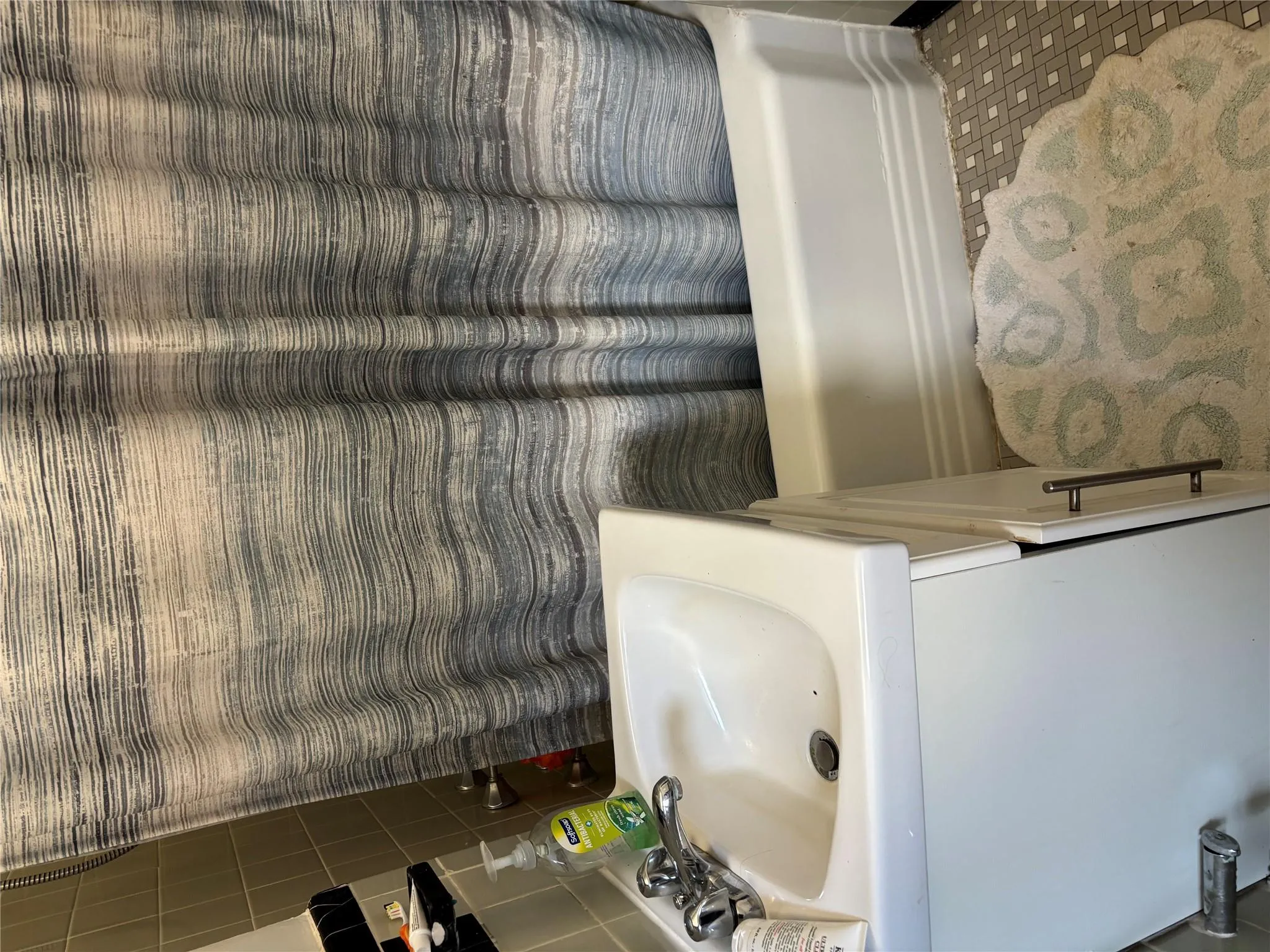 Bathroom with shower / bath combo with shower curtain and vanity Bathroom with shower / bath combo with shower curtain and vanity