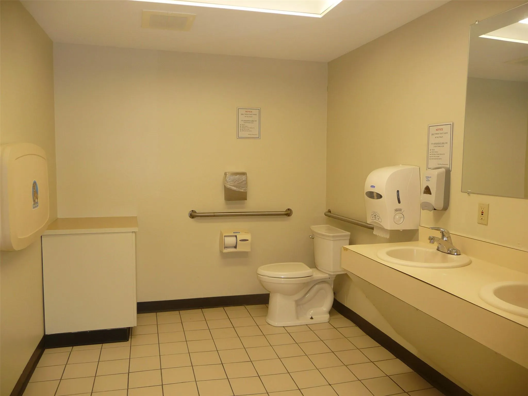 Bathroom featuring double vanity and tile patterned flooring Bathroom featuring double vanity and tile patterned flooring