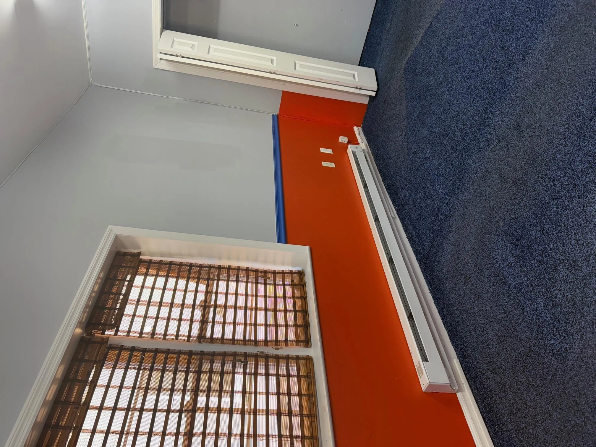 Spare room featuring baseboard heating and carpet Spare room featuring baseboard heating and carpet