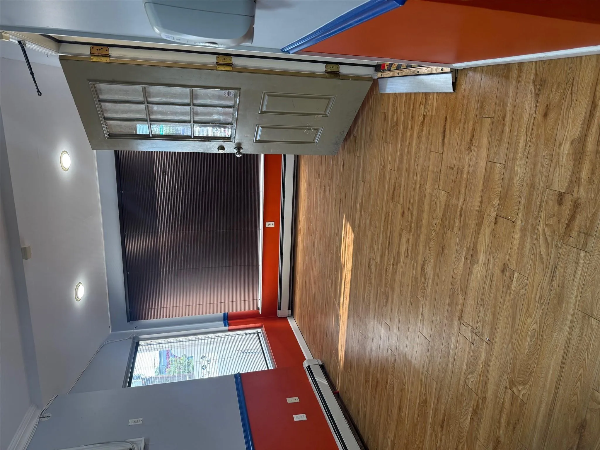 Empty room featuring a baseboard radiator, wood finished floors, baseboard heating, and recessed lighting Empty room featuring a baseboard radiator, wood finished floors, baseboard heating, and recessed lighting