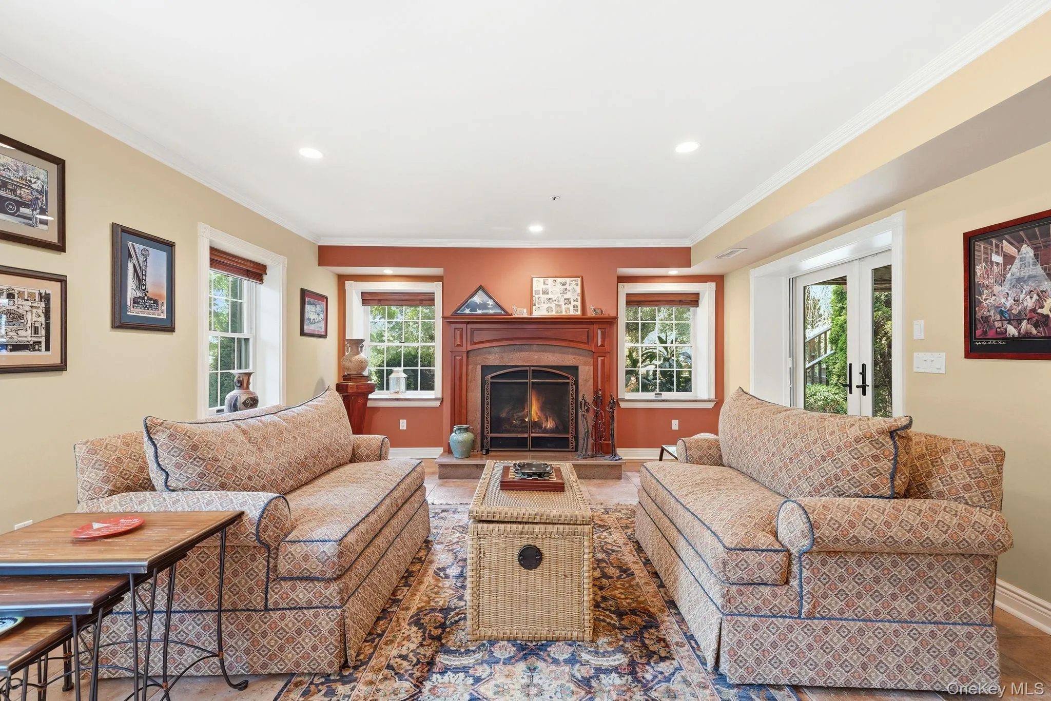 Family room with gas fireplace in terrace level with Bar and walk-out access to patio. Family room with gas fireplace in terrace level with Bar and walk-out access to patio.