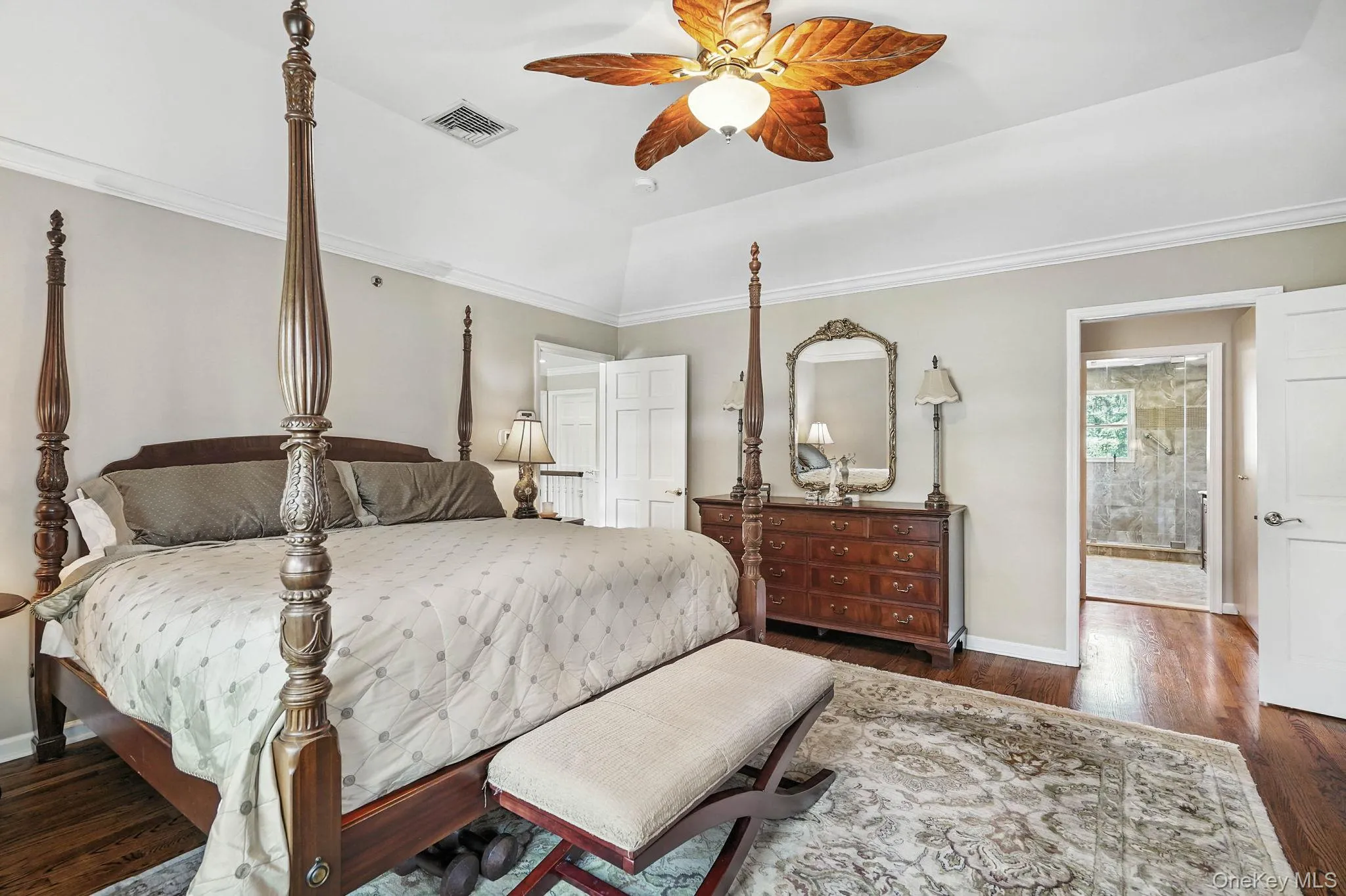 Bedroom featuring raised ceiling, Large walk-in closet and dressing area with attached ensuite double vanity bathroom. Bedroom featuring raised ceiling, Large walk-in closet and dressing area with attached ensuite double vanity bathroom.