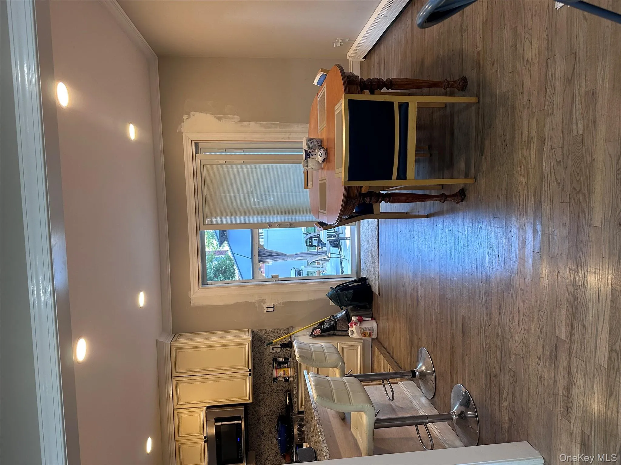 Dining room featuring crown molding, dark wood-type flooring, baseboard heating, and recessed lighting Dining room featuring crown molding, dark wood-type flooring, baseboard heating, and recessed lighting