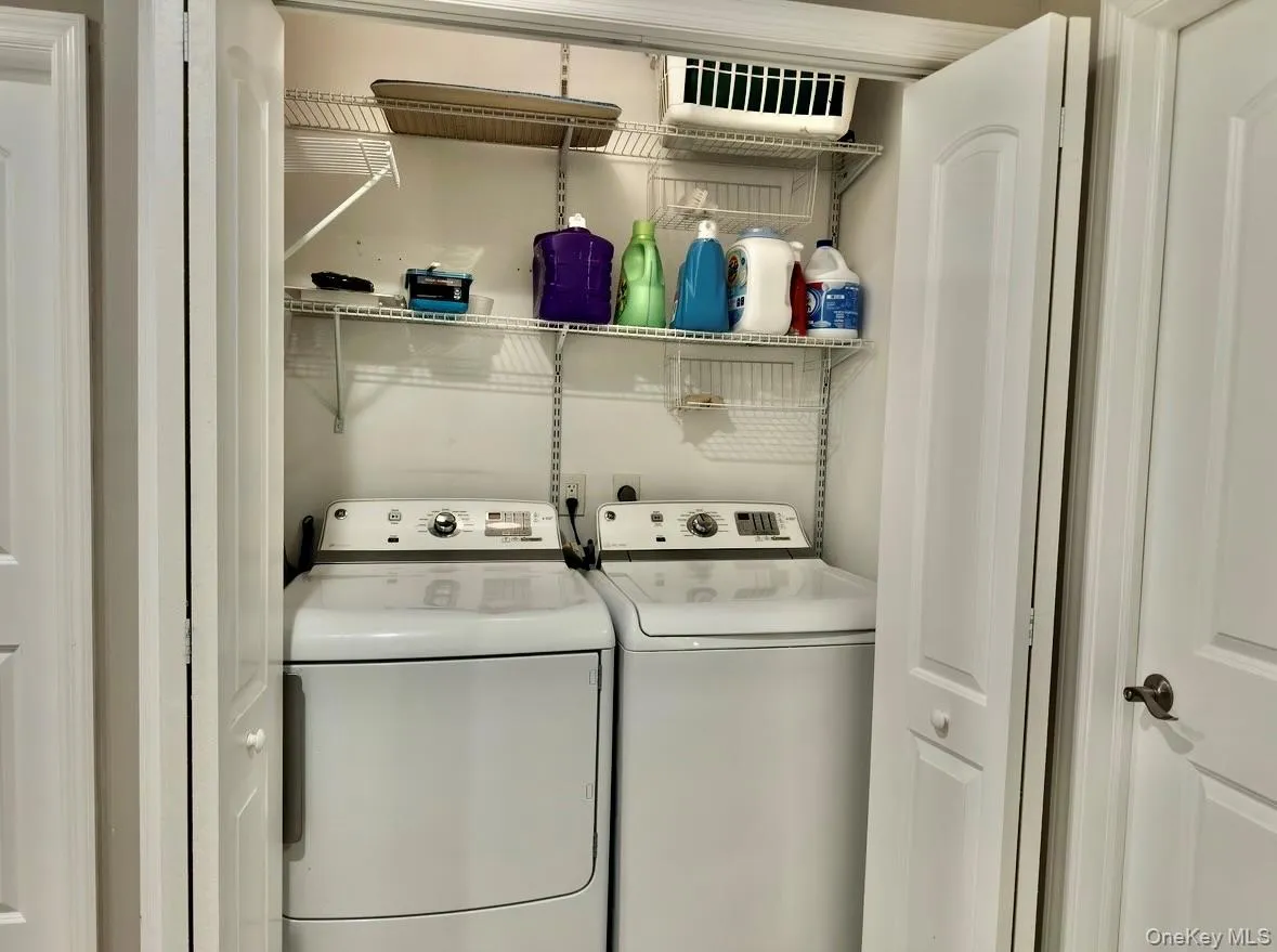 Laundry room featuring washer and clothes dryer Laundry room featuring washer and clothes dryer