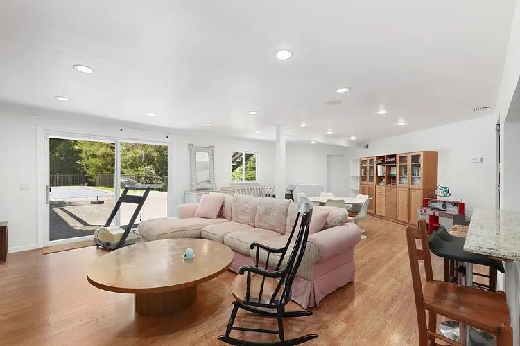 Living room featuring light wood-style floors and recessed lighting Living room featuring light wood-style floors and recessed lighting