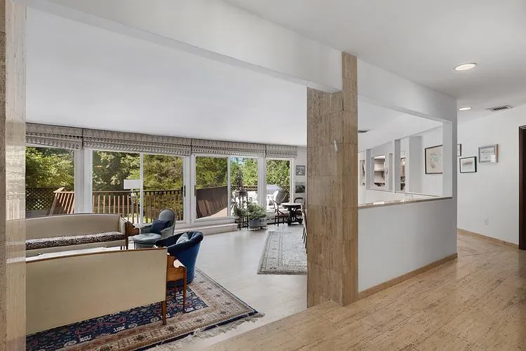Living room featuring wood finished floors and recessed lighting Living room featuring wood finished floors and recessed lighting