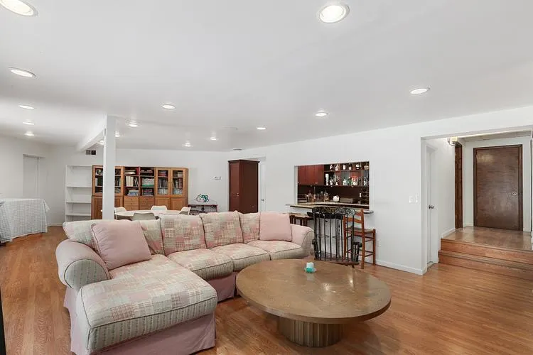 Living area featuring light wood-type flooring and recessed lighting Living area featuring light wood-type flooring and recessed lighting