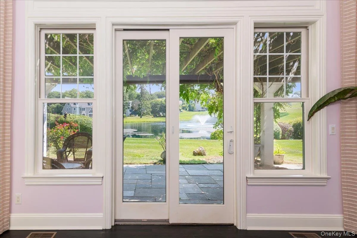Sliding Door to a Large Blue Stone Patio on the Pond Side Sliding Door to a Large Blue Stone Patio on the Pond Side