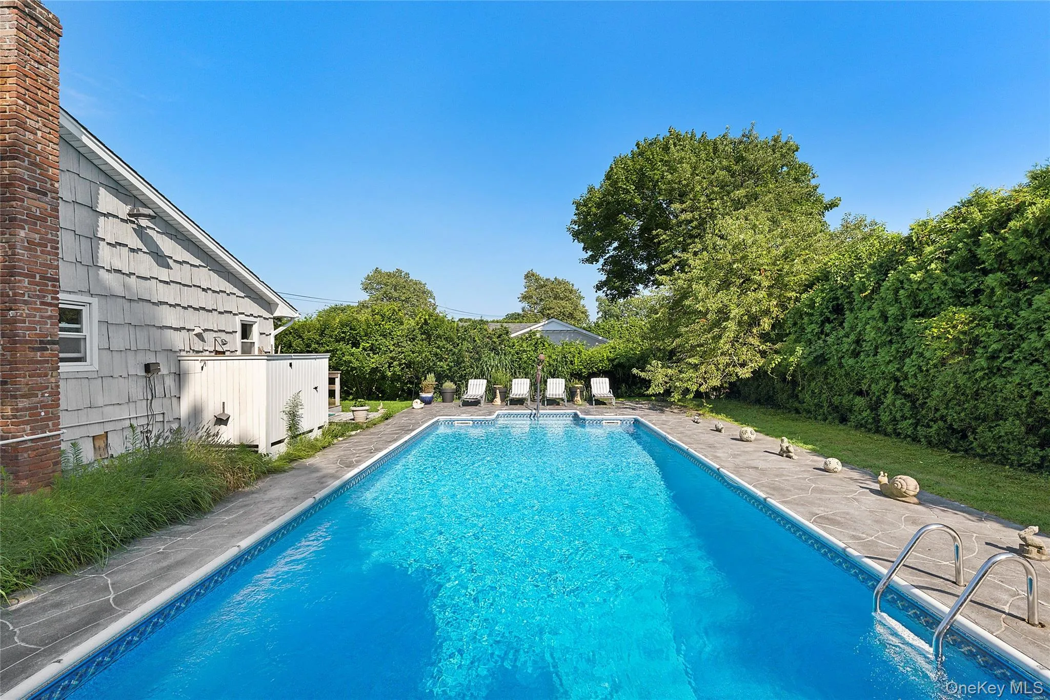 View of swimming pool featuring a patio View of swimming pool featuring a patio