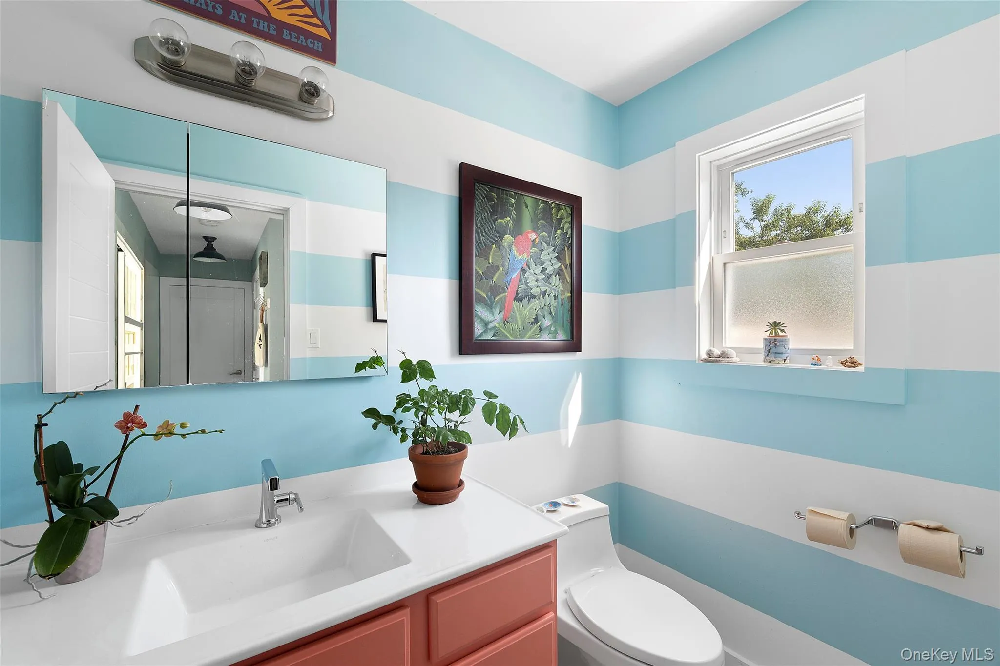 Bathroom featuring toilet and vanity Bathroom featuring toilet and vanity