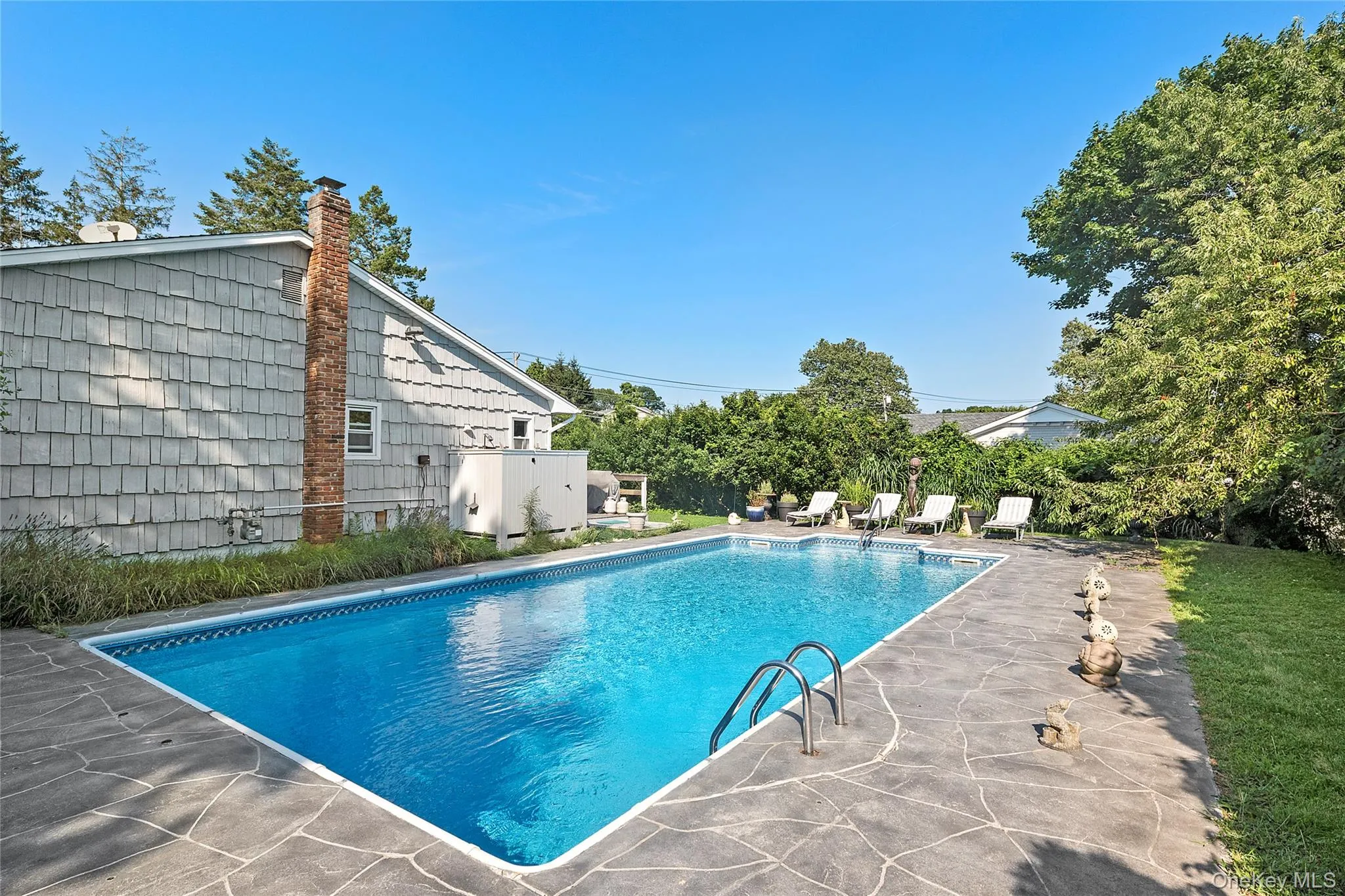 View of swimming pool with a patio area View of swimming pool with a patio area