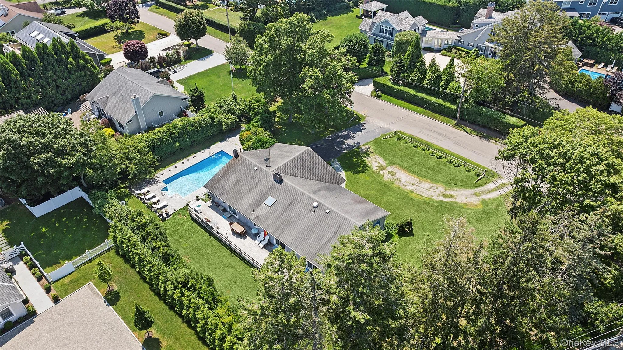 Aerial view of residential area with a pool Aerial view of residential area with a pool