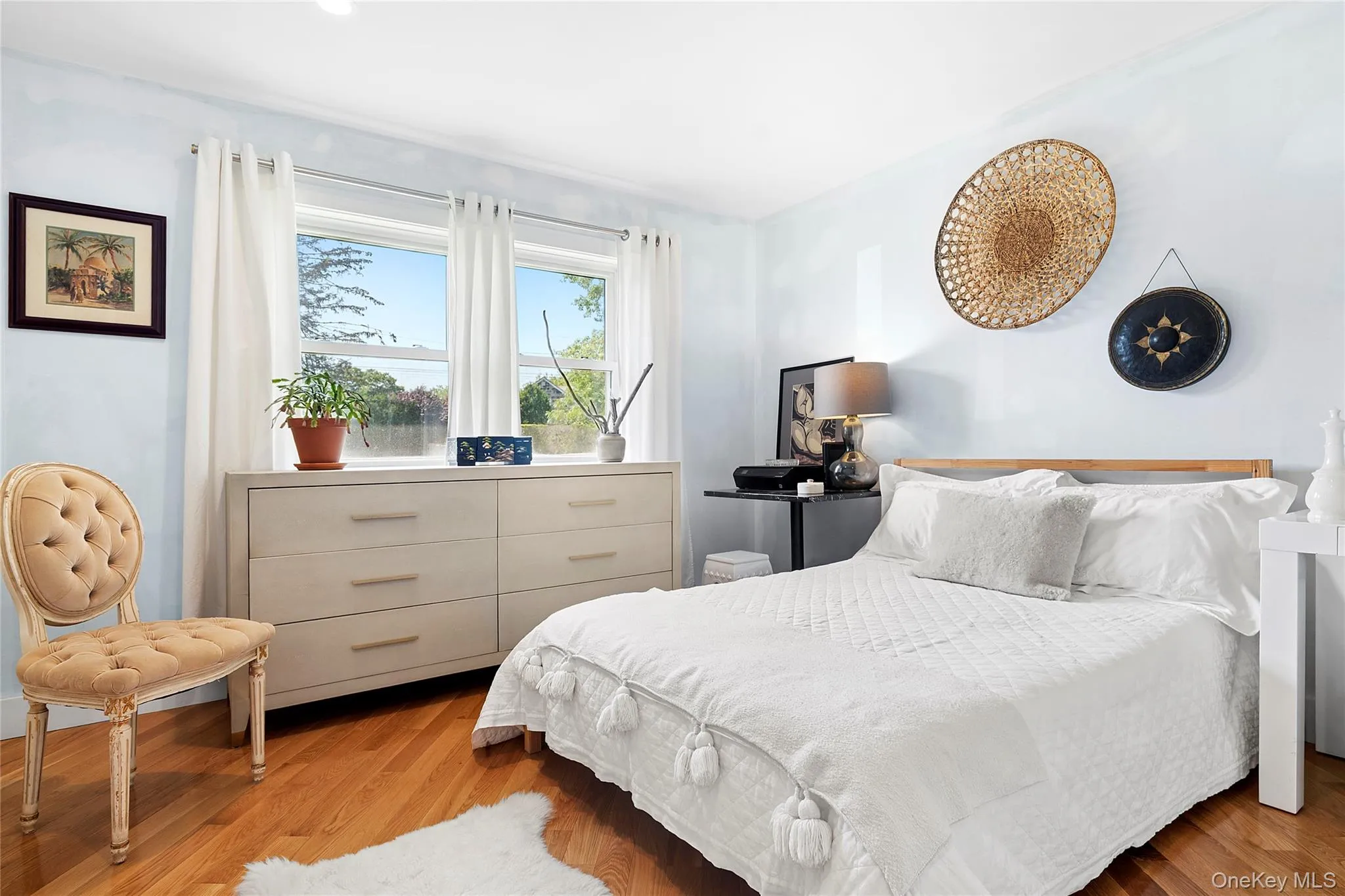 Bedroom featuring wood finished floors Bedroom featuring wood finished floors