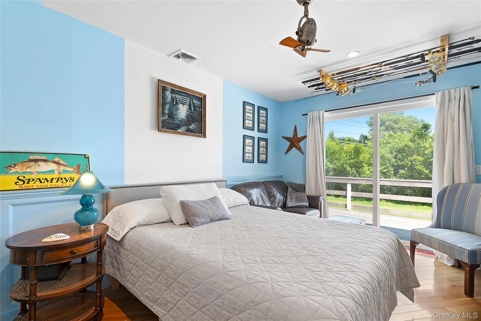 Bedroom with wood finished floors and ceiling fan Bedroom with wood finished floors and ceiling fan