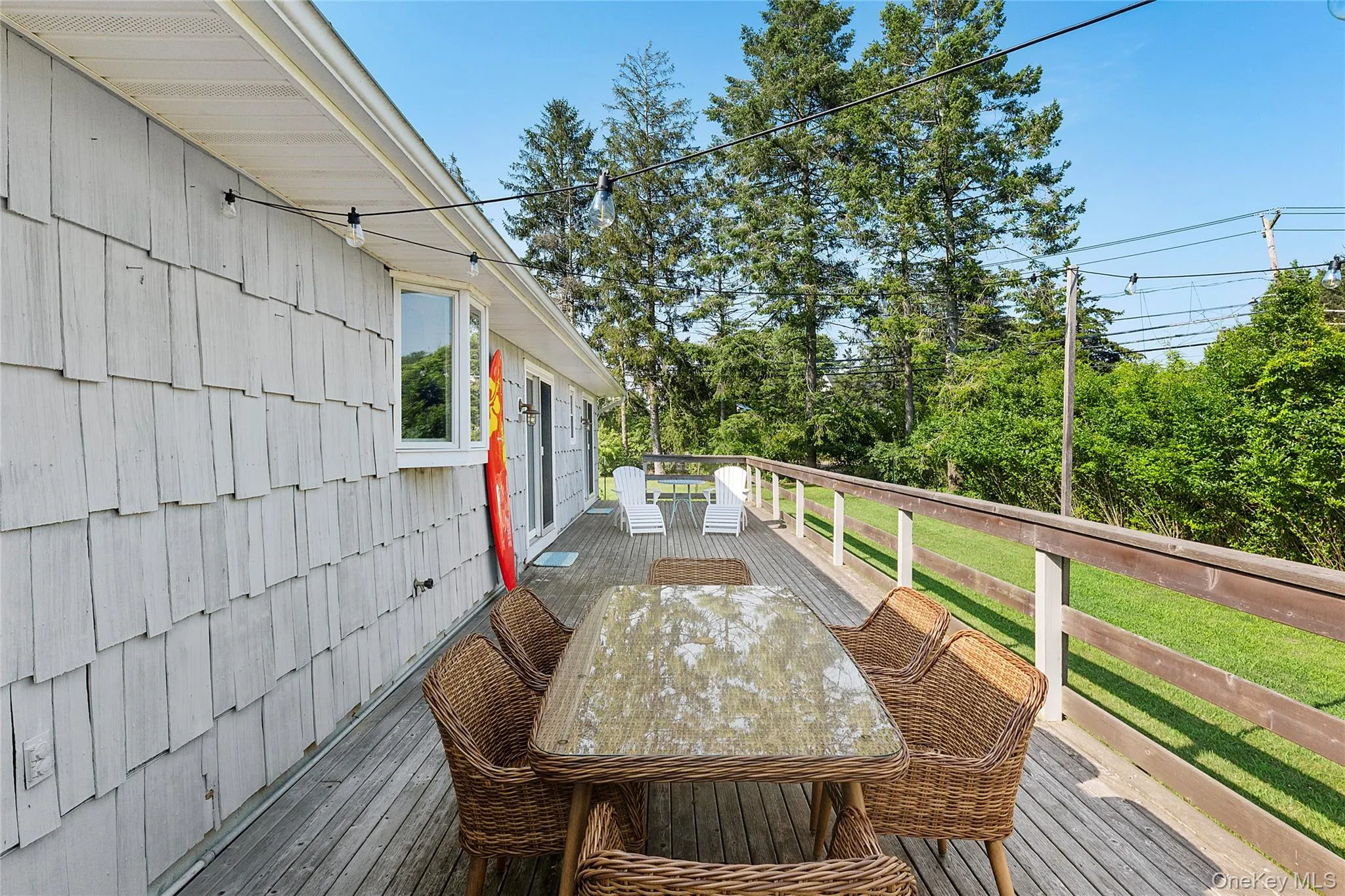 Wooden terrace featuring outdoor dining space Wooden terrace featuring outdoor dining space
