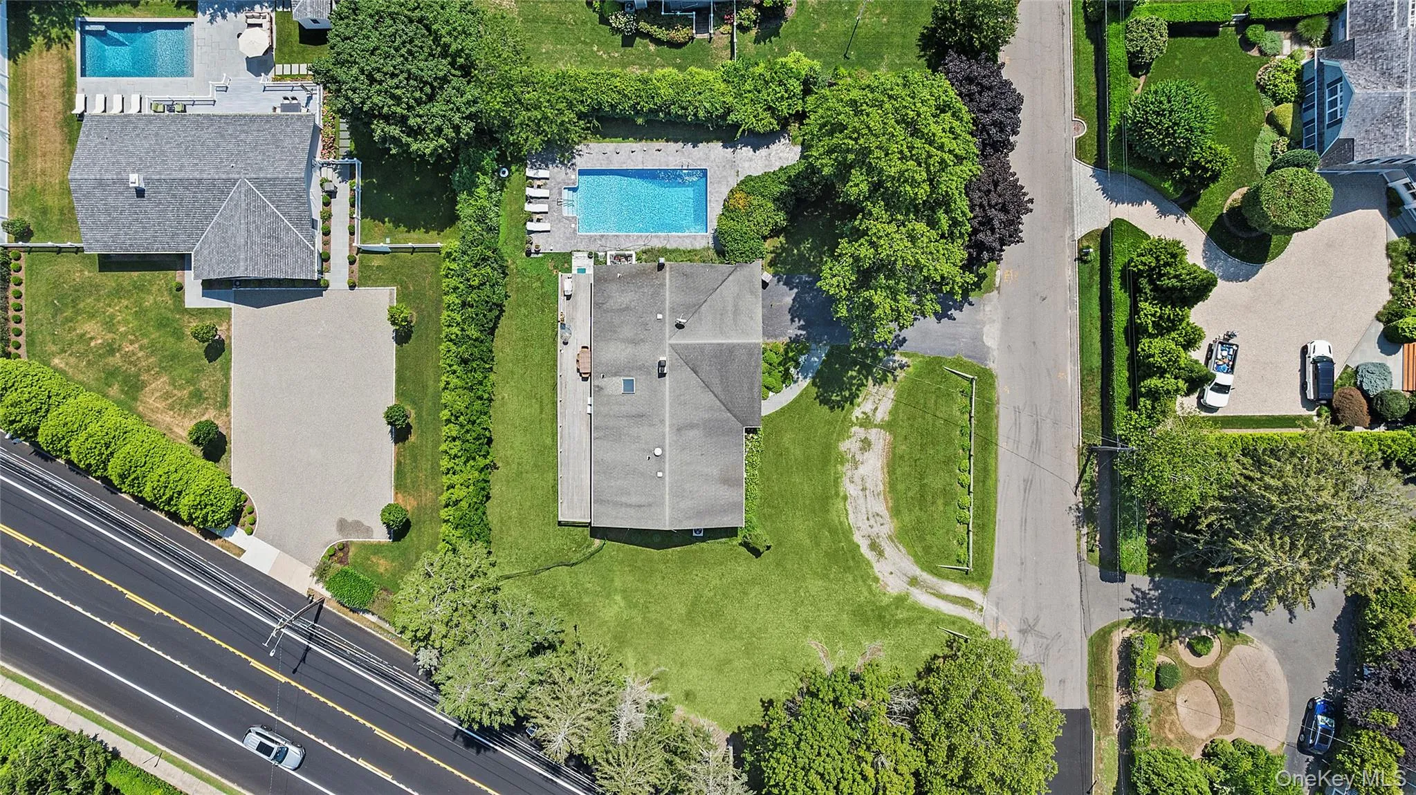 Aerial view of property's location featuring a pool area Aerial view of property's location featuring a pool area
