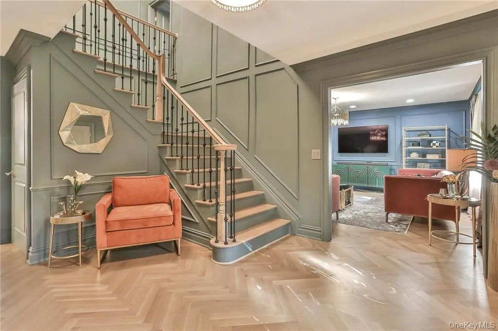 Staircase featuring a decorative wall Staircase featuring a decorative wall