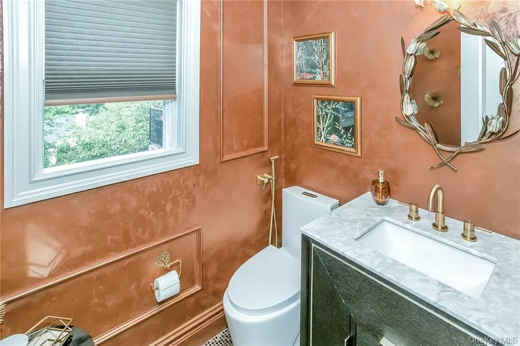 Bathroom featuring vanity and toilet Bathroom featuring vanity and toilet