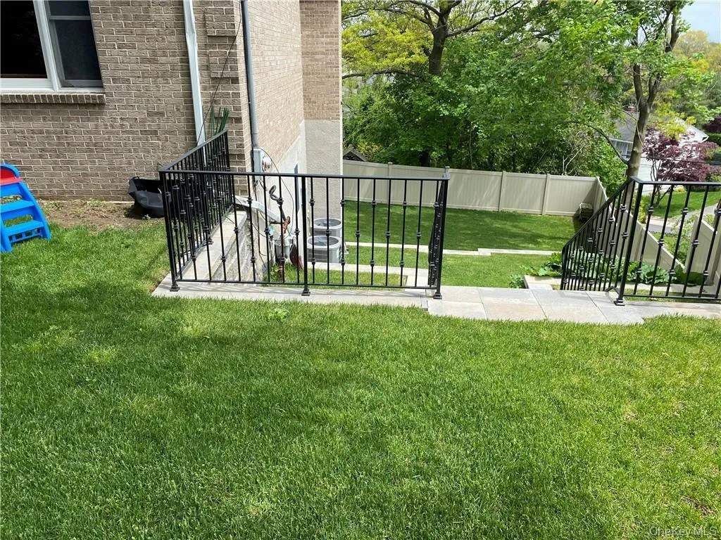 View of yard with stairs View of yard with stairs