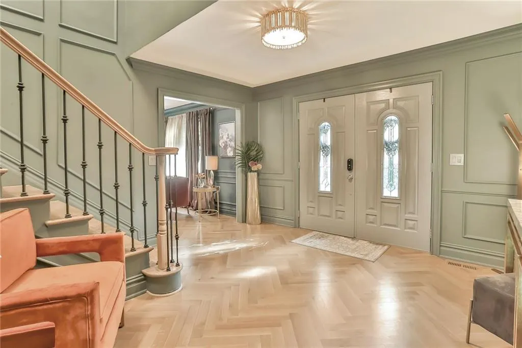 Foyer entrance with a decorative wall and stairway Foyer entrance with a decorative wall and stairway