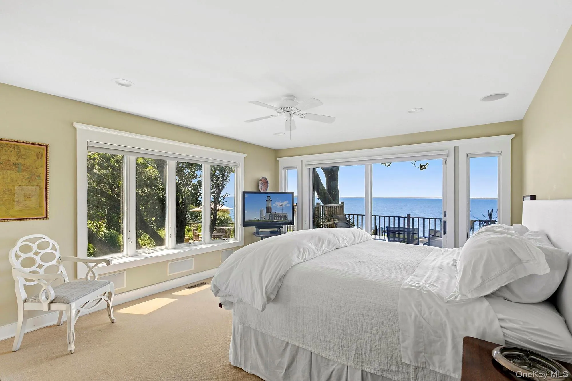 Carpeted bedroom with access to exterior, ceiling fan, and recessed lighting Carpeted bedroom with access to exterior, ceiling fan, and recessed lighting