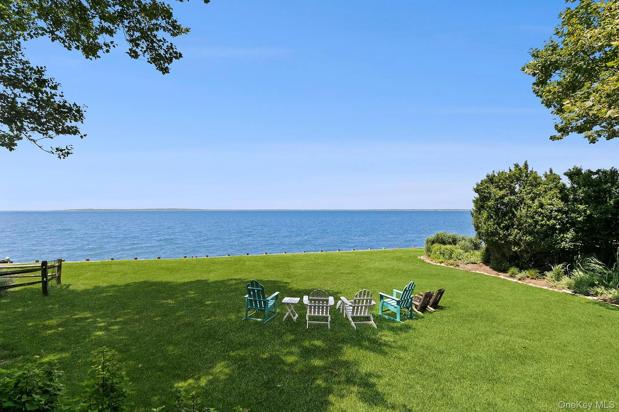 View of grassy yard featuring a water view View of grassy yard featuring a water view