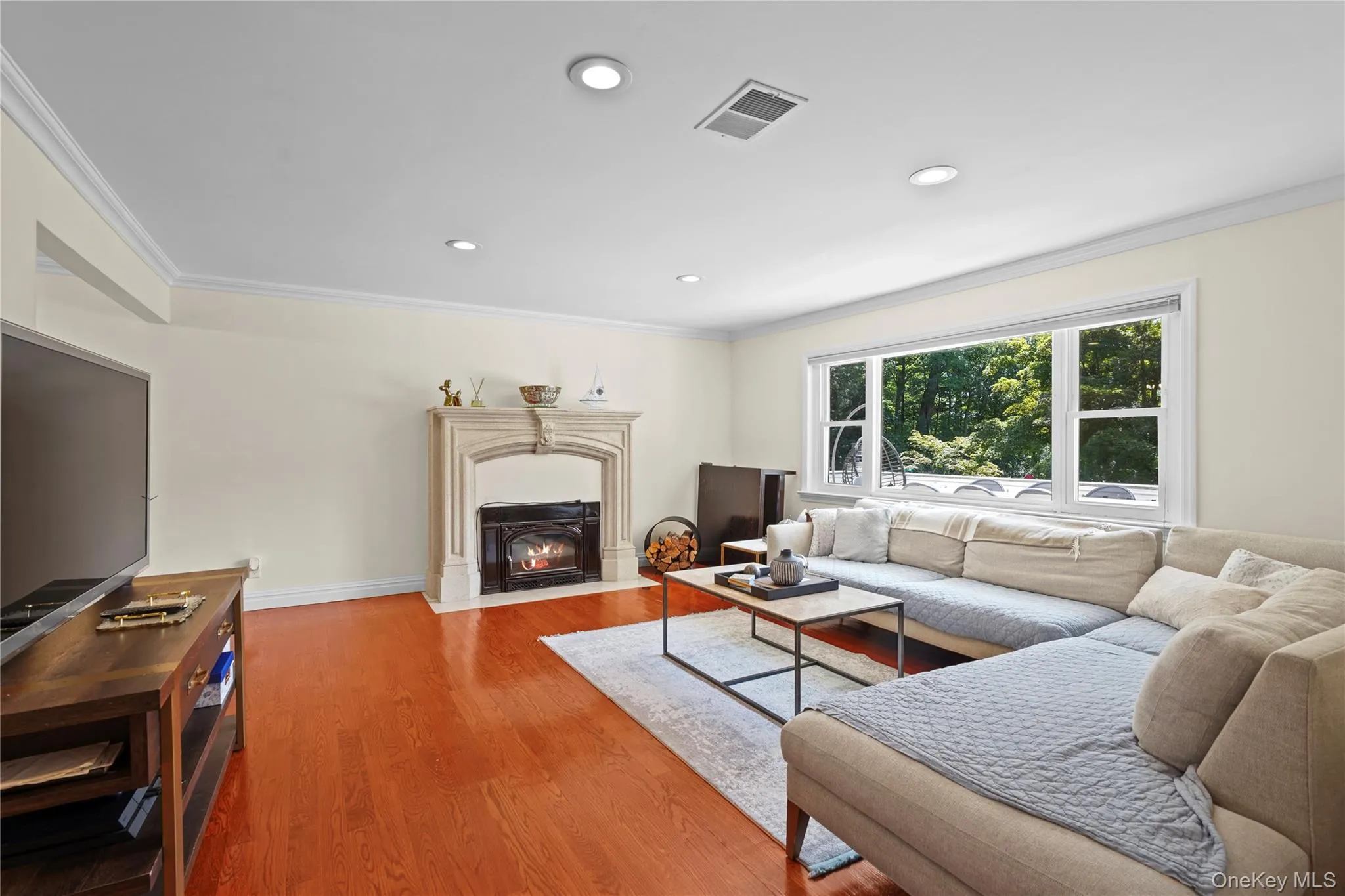 Living area boasts electric fireplace with stone surround Living area boasts electric fireplace with stone surround