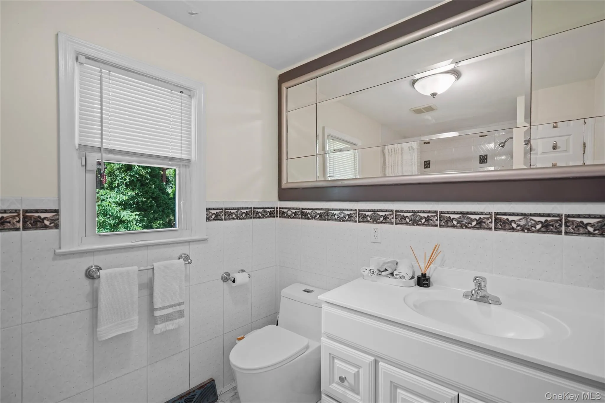 Full hall bath with classic tile finishes Full hall bath with classic tile finishes