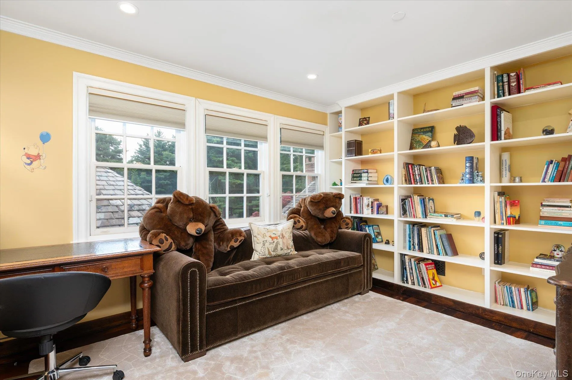 Sitting room with healthy amount of natural light, crown molding, and recessed lighting Sitting room with healthy amount of natural light, crown molding, and recessed lighting