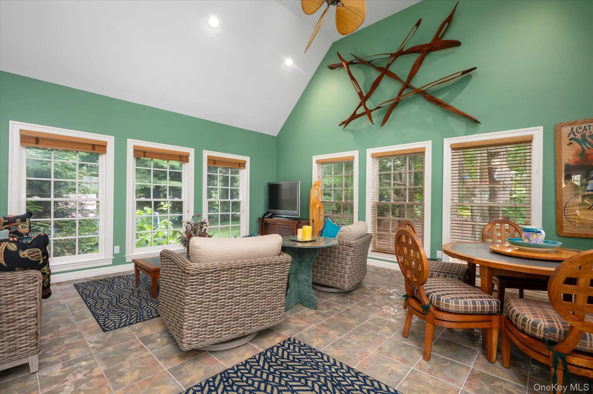 Sunroom / solarium featuring high vaulted ceiling and recessed lighting Sunroom / solarium featuring high vaulted ceiling and recessed lighting