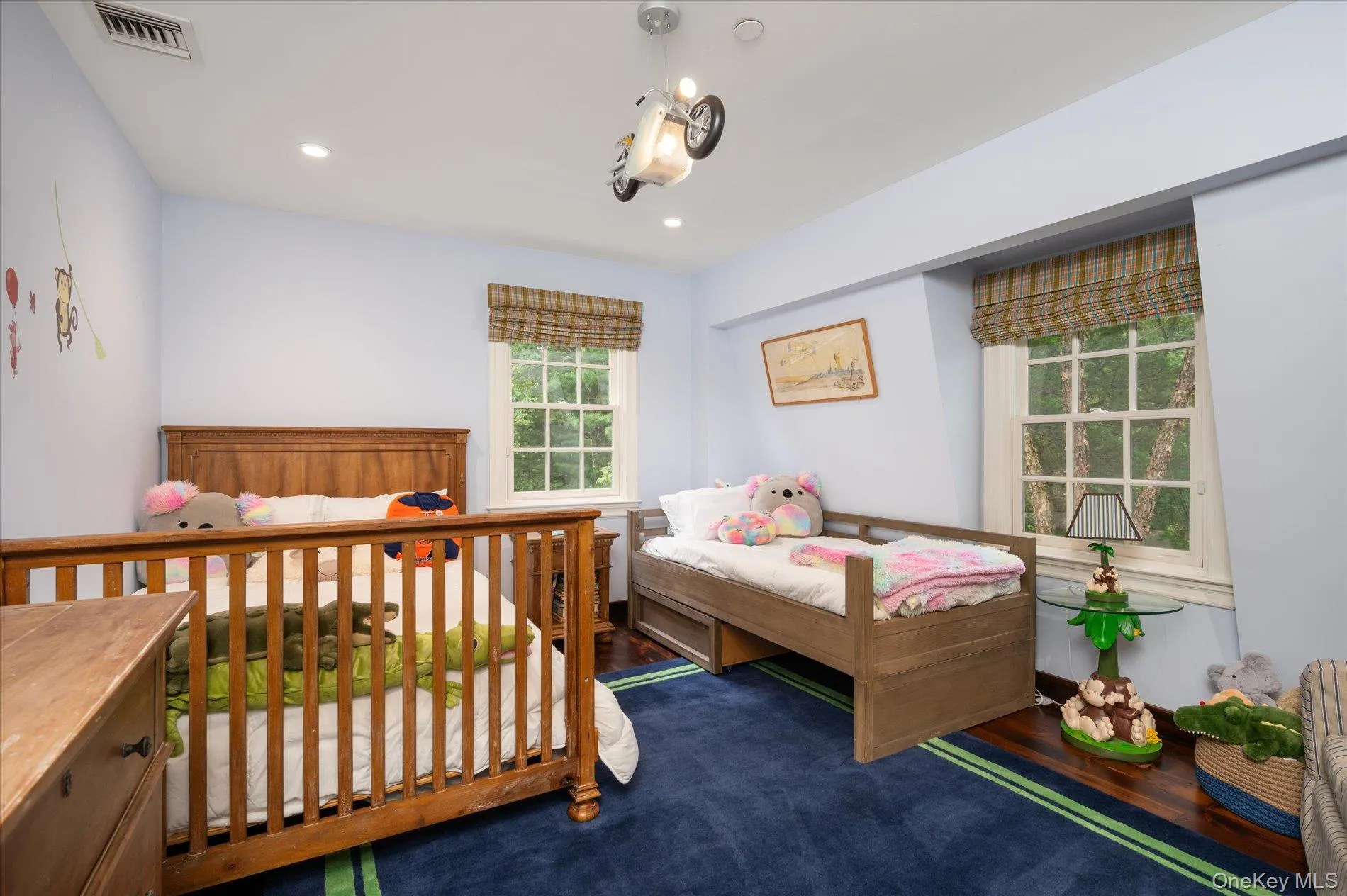 Bedroom with wood finished floors and recessed lighting Bedroom with wood finished floors and recessed lighting