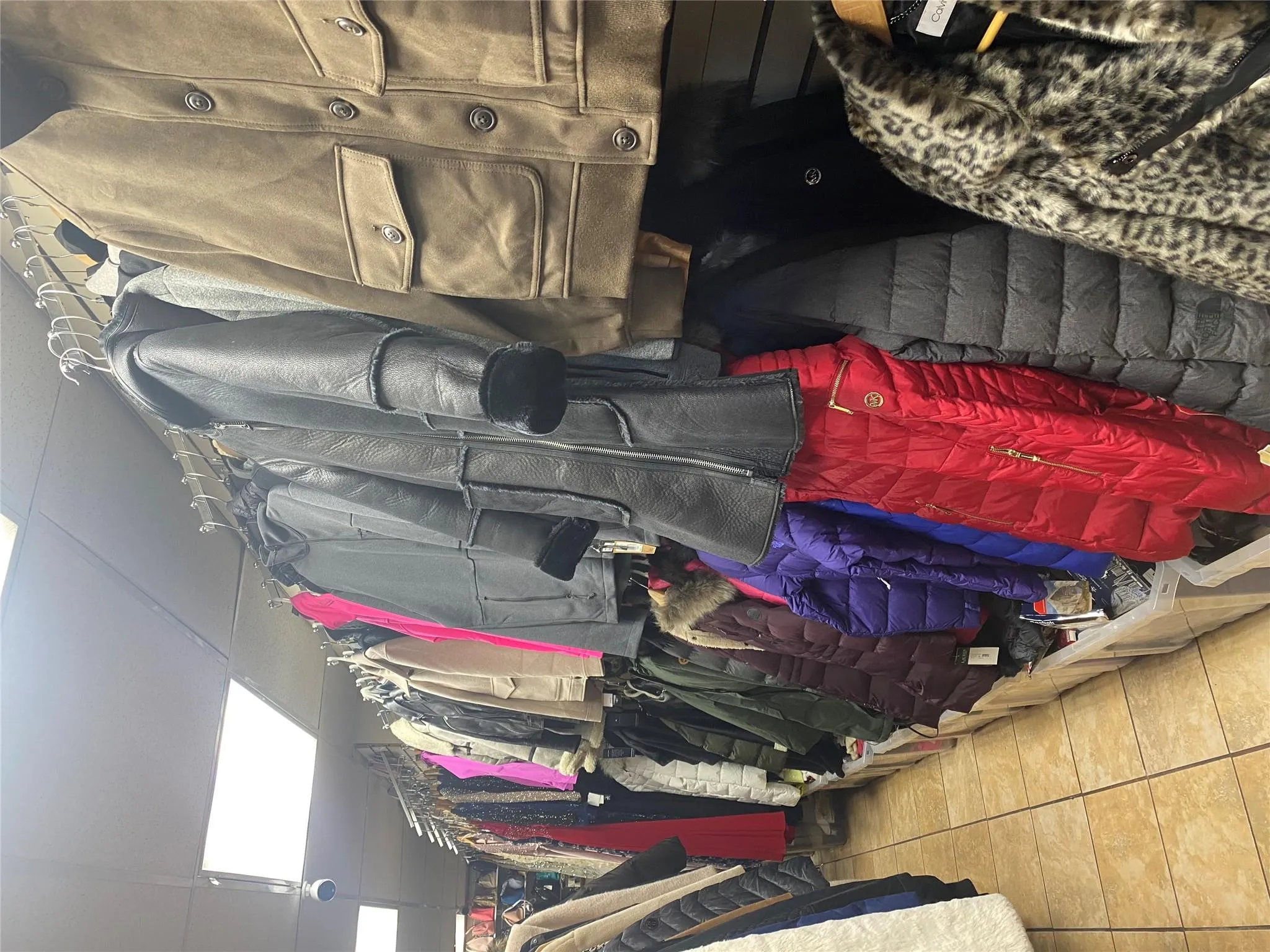 Spacious closet with tile patterned floors and a drop ceiling Spacious closet with tile patterned floors and a drop ceiling