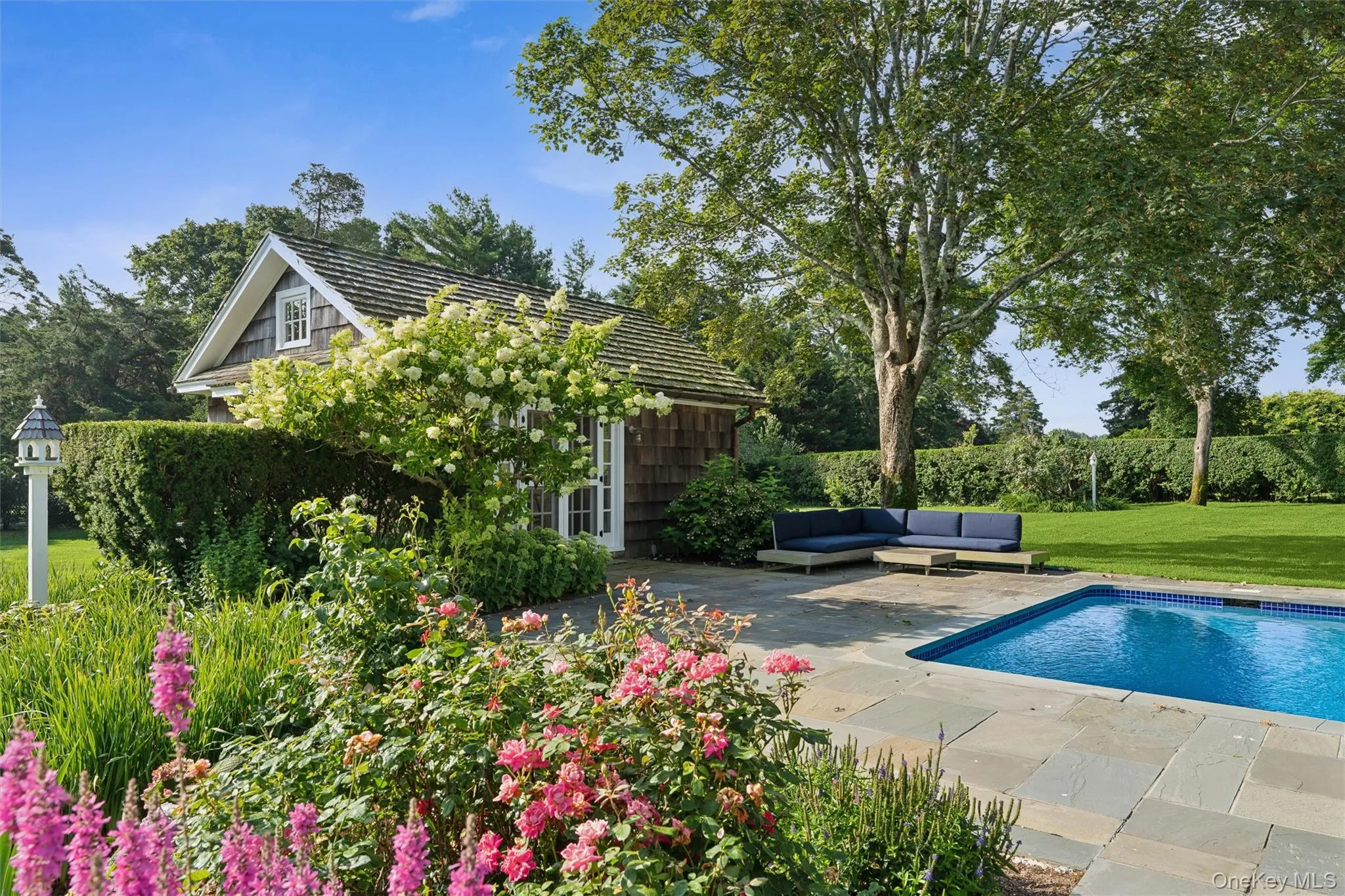 View of pool with an outdoor hangout area, a patio, and a yard View of pool with an outdoor hangout area, a patio, and a yard