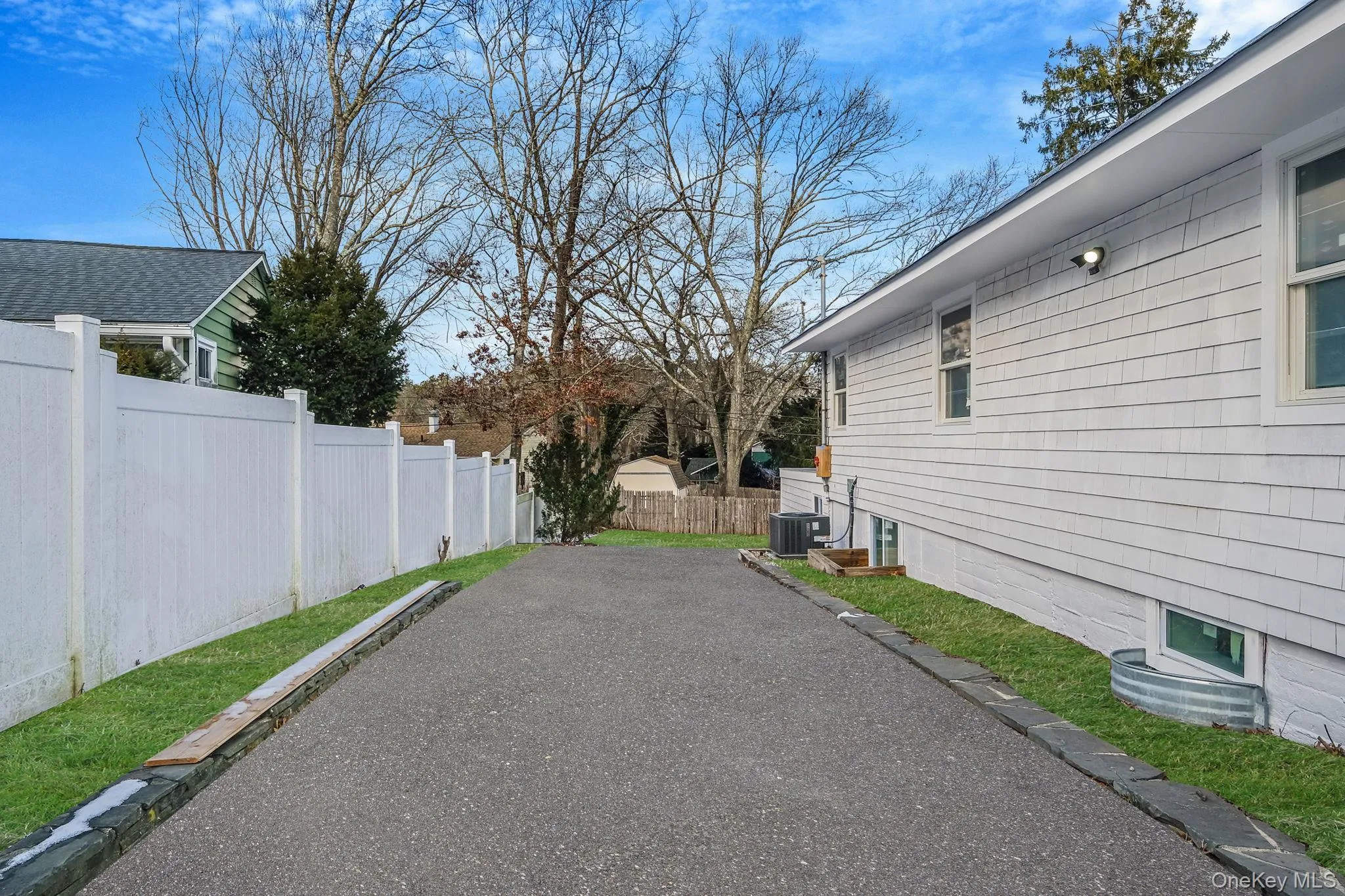 View of yard with driveway View of yard with driveway