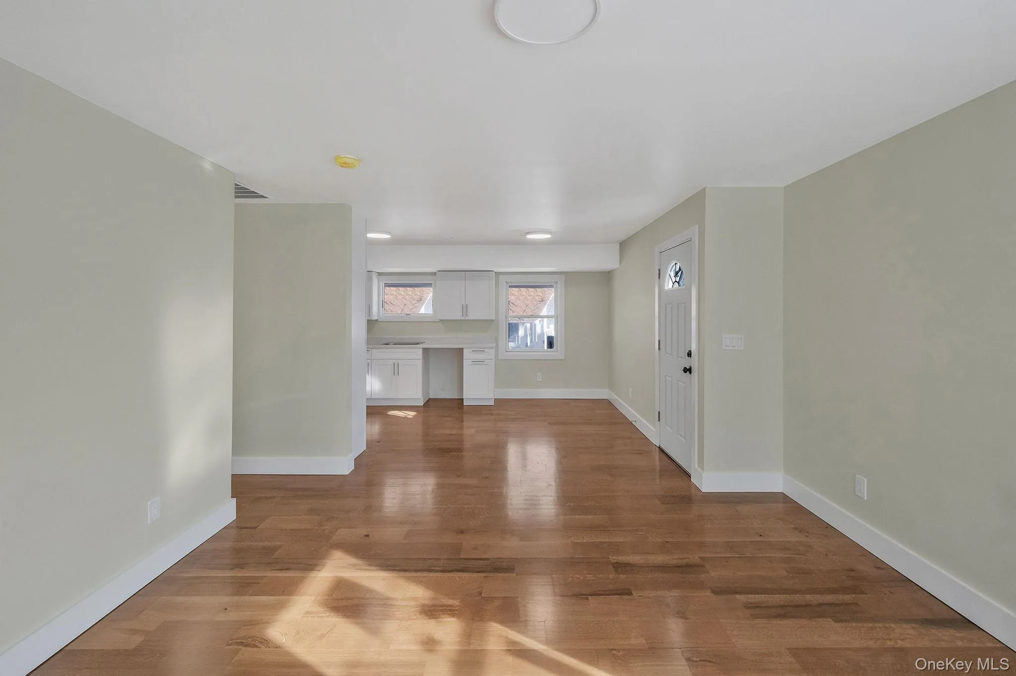 Unfurnished living room with wood finished floors Unfurnished living room with wood finished floors