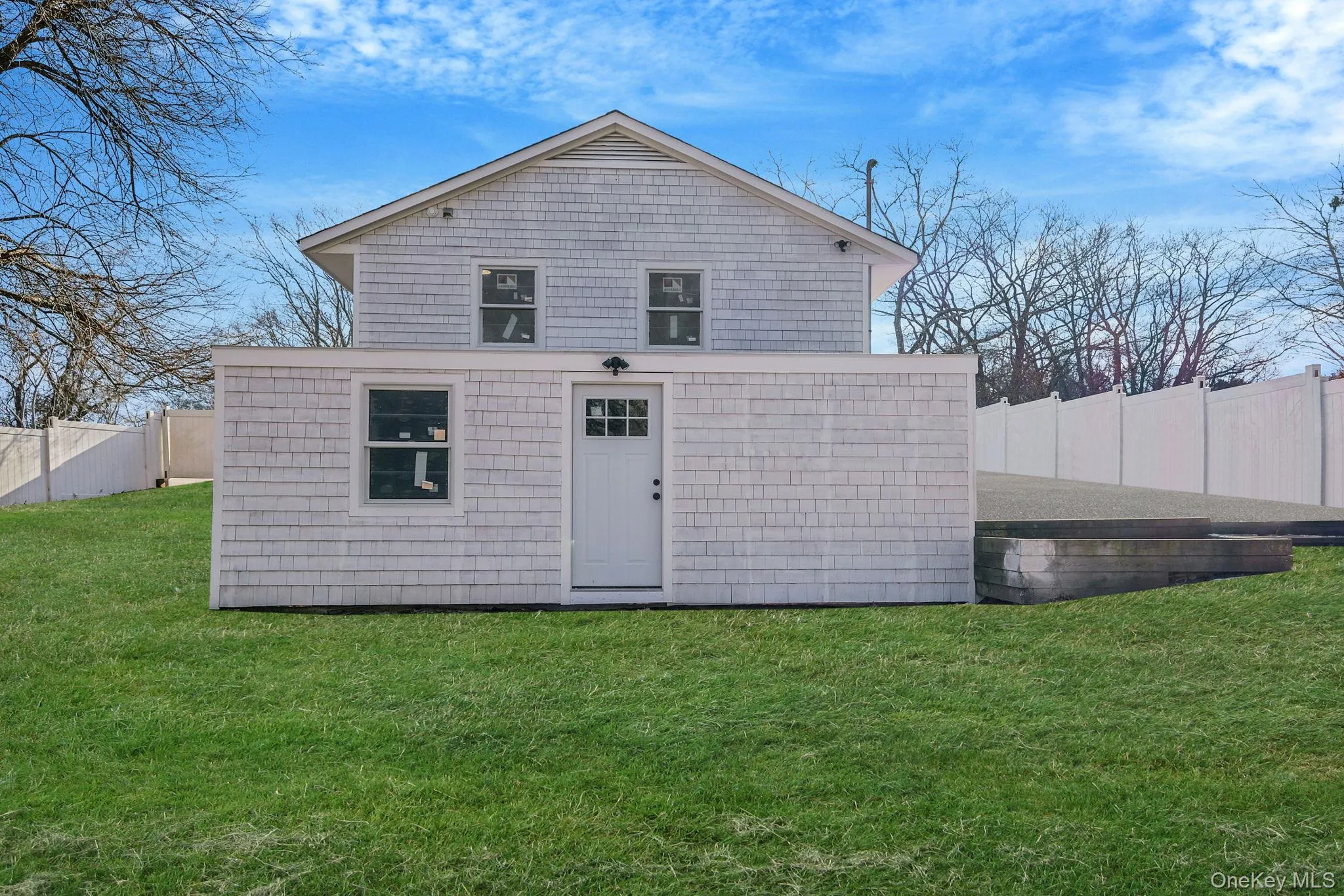 Back of property with an outdoor structure Back of property with an outdoor structure