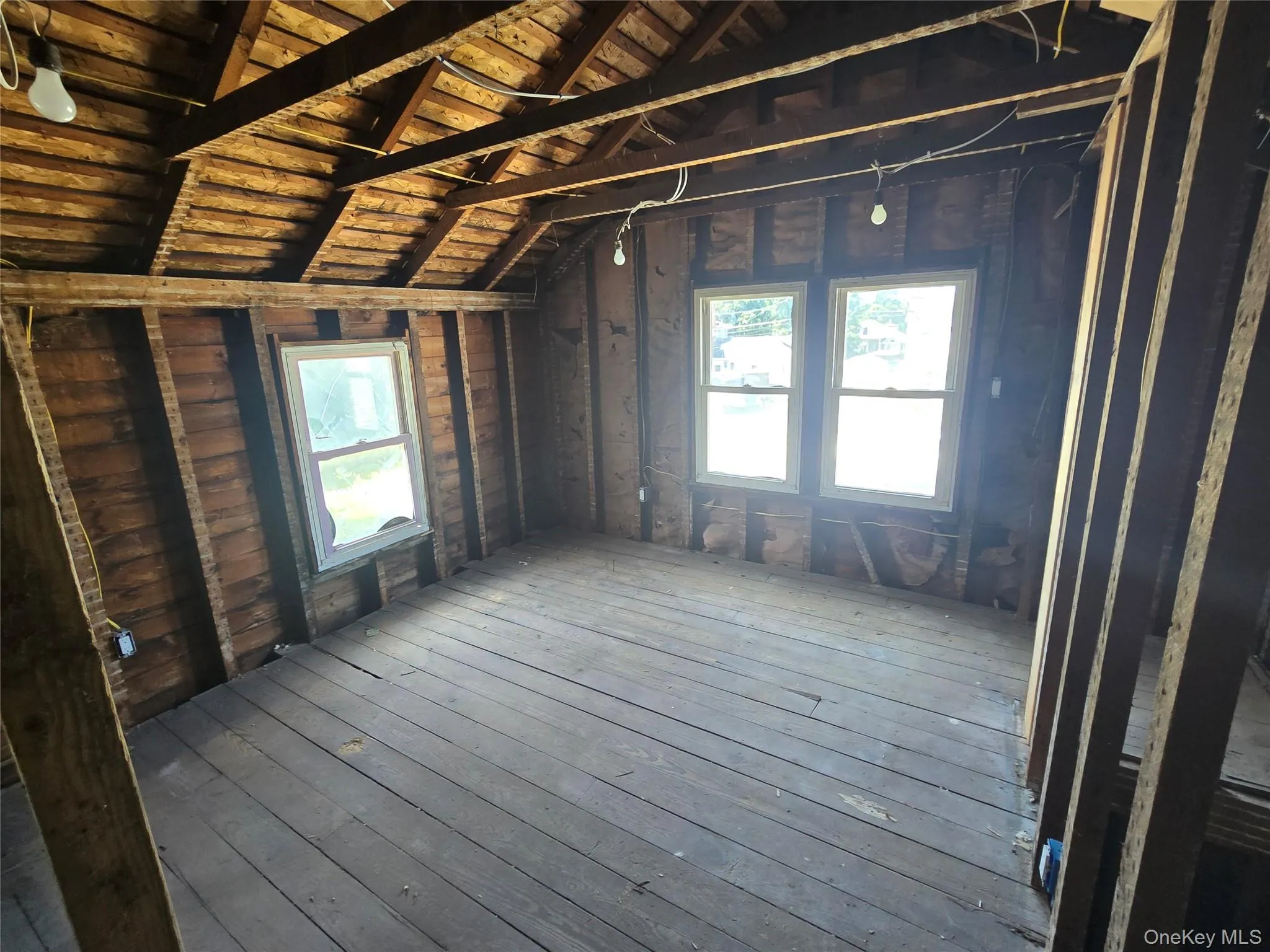 Unfinished attic featuring plenty of natural light Unfinished attic featuring plenty of natural light