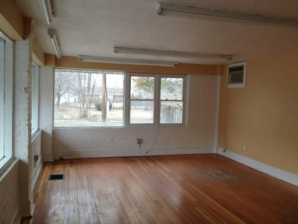 Unit B: Retail/Office space with wood finished floors and large windows Unit B: Retail/Office space with wood finished floors and large windows