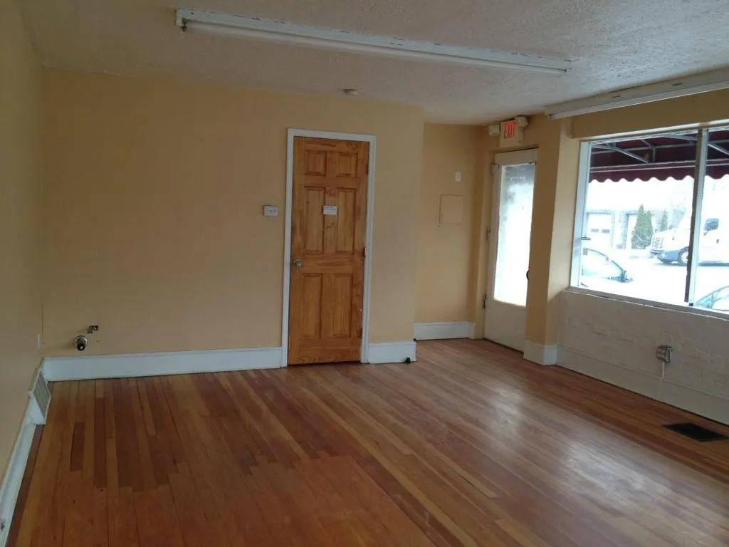 Unit B: Retail/Office space with wood finished floors and large windows Unit B: Retail/Office space with wood finished floors and large windows