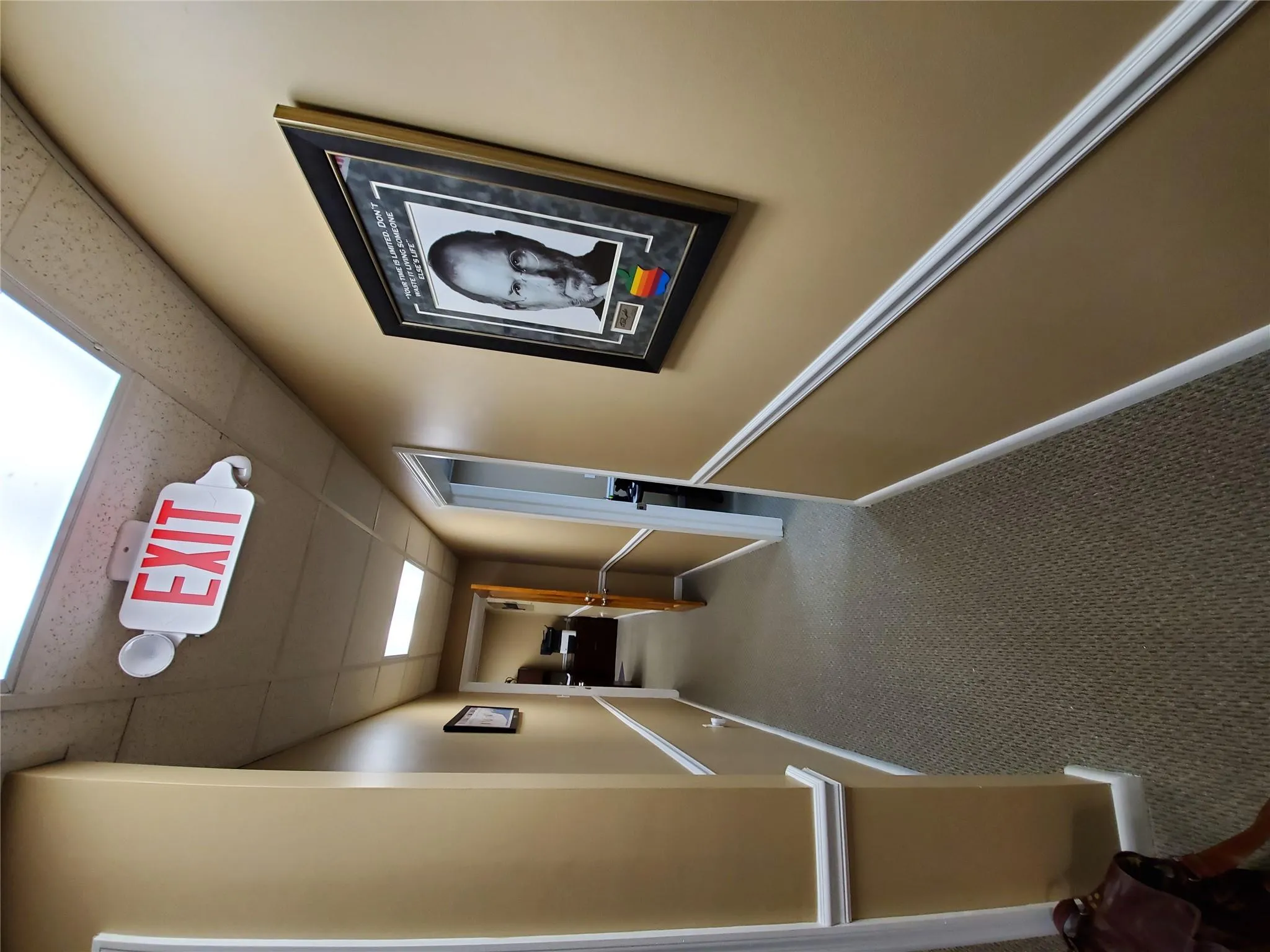 Corridor featuring a drop ceiling and carpet Corridor featuring a drop ceiling and carpet