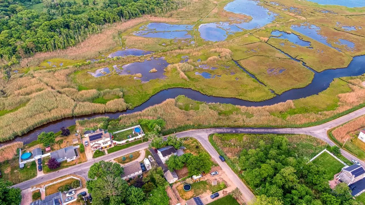 Aerial overview of property's location featuring a nearby body of water Aerial overview of property's location featuring a nearby body of water