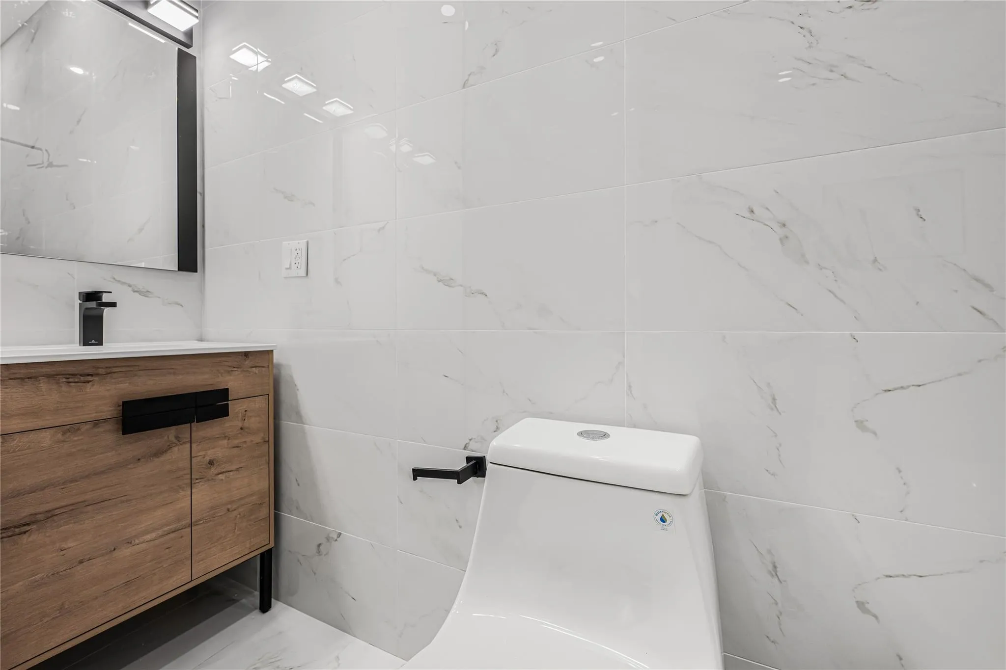 Bathroom with vanity and tile walls Bathroom with vanity and tile walls