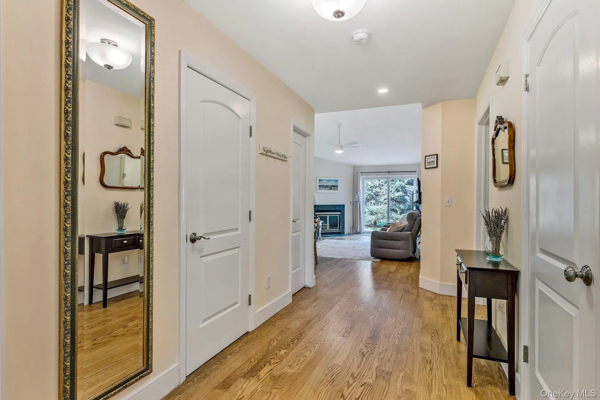 Corridor featuring light wood-type flooring and recessed lighting Corridor featuring light wood-type flooring and recessed lighting