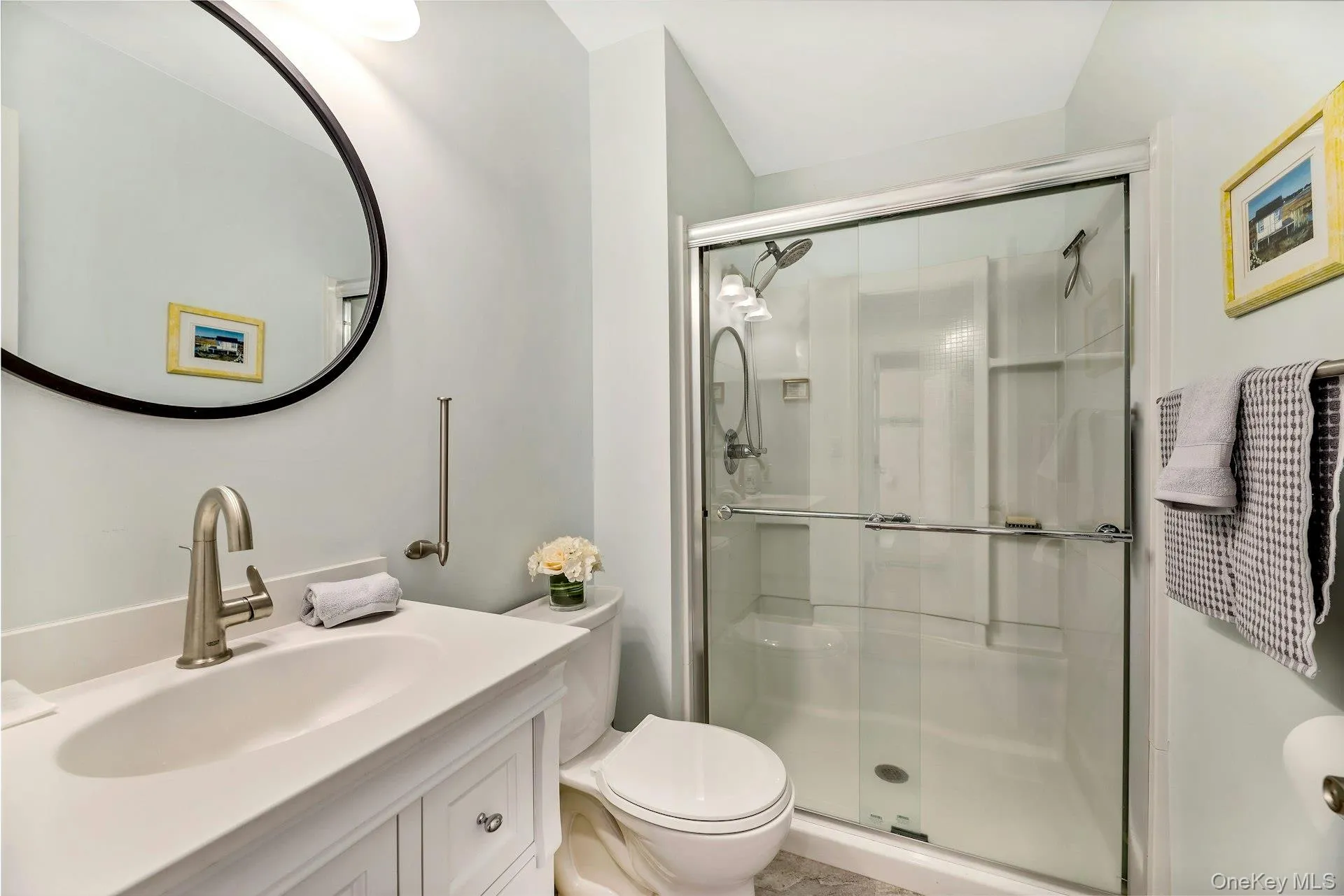 Bathroom featuring vanity and a stall shower Bathroom featuring vanity and a stall shower