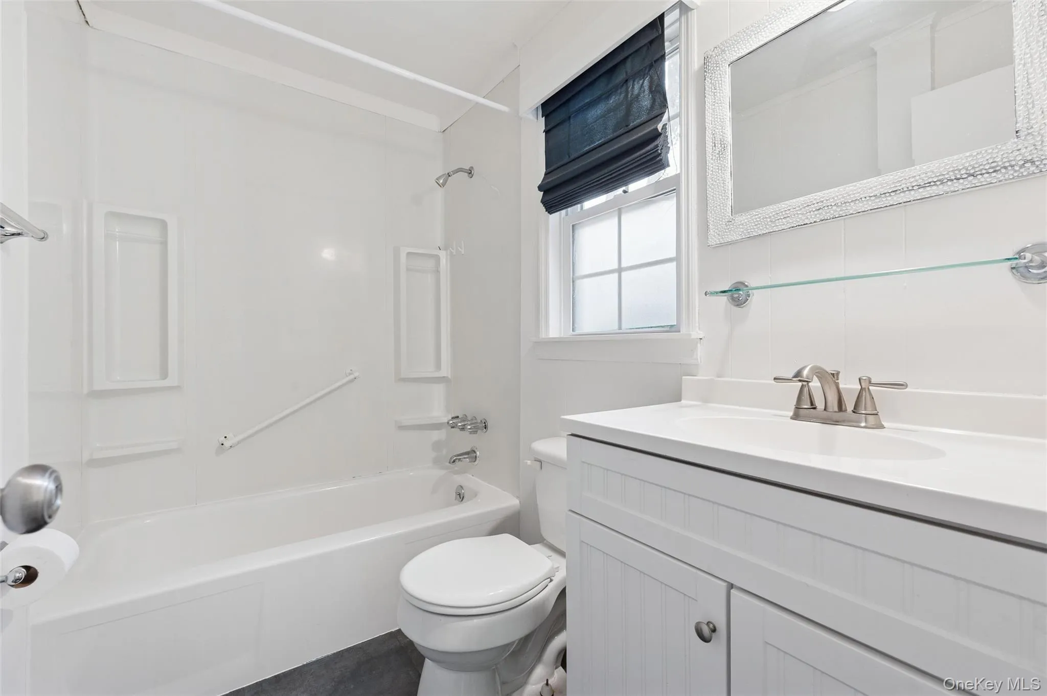 Bathroom with vanity and shower / bathtub combination Bathroom with vanity and shower / bathtub combination