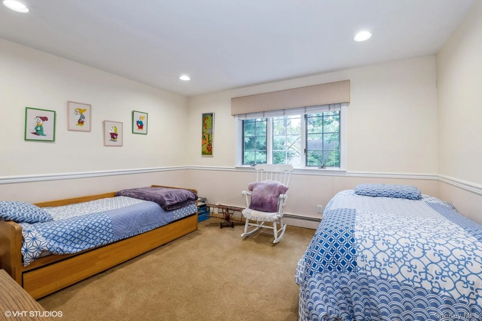 Bedroom featuring carpet floors, recessed lighting, and a baseboard radiator Bedroom featuring carpet floors, recessed lighting, and a baseboard radiator