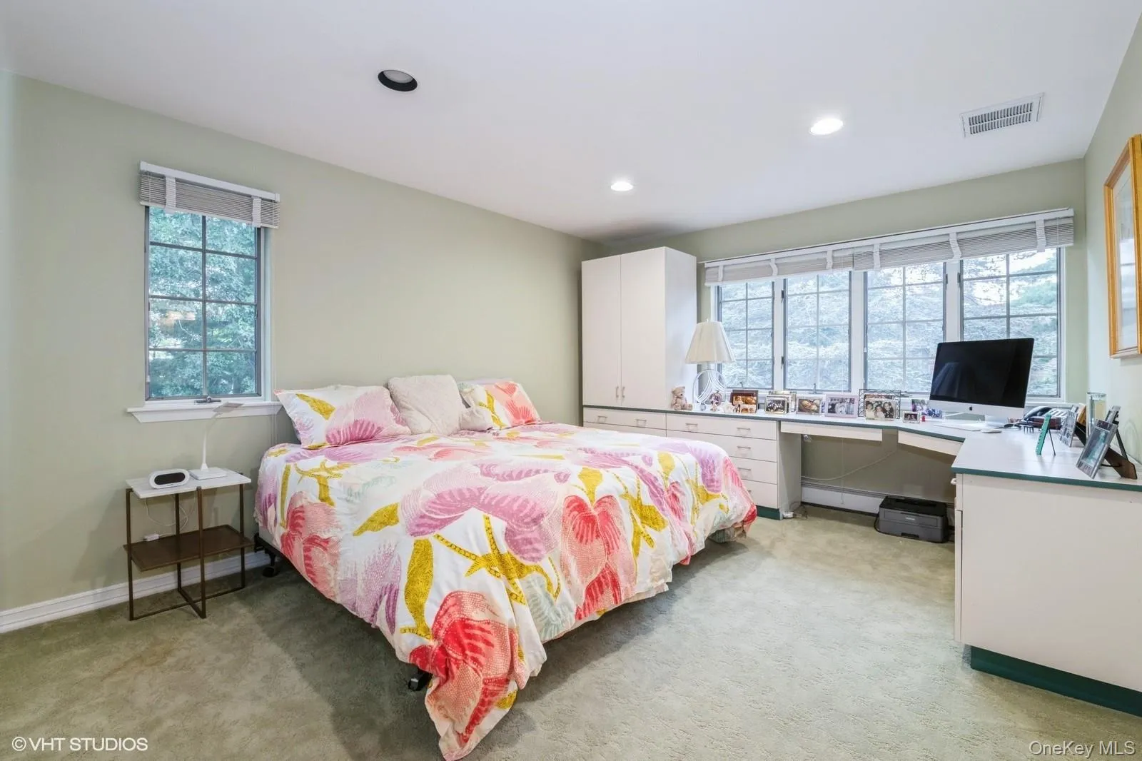 Bedroom with light carpet, an office area, and recessed lighting Bedroom with light carpet, an office area, and recessed lighting