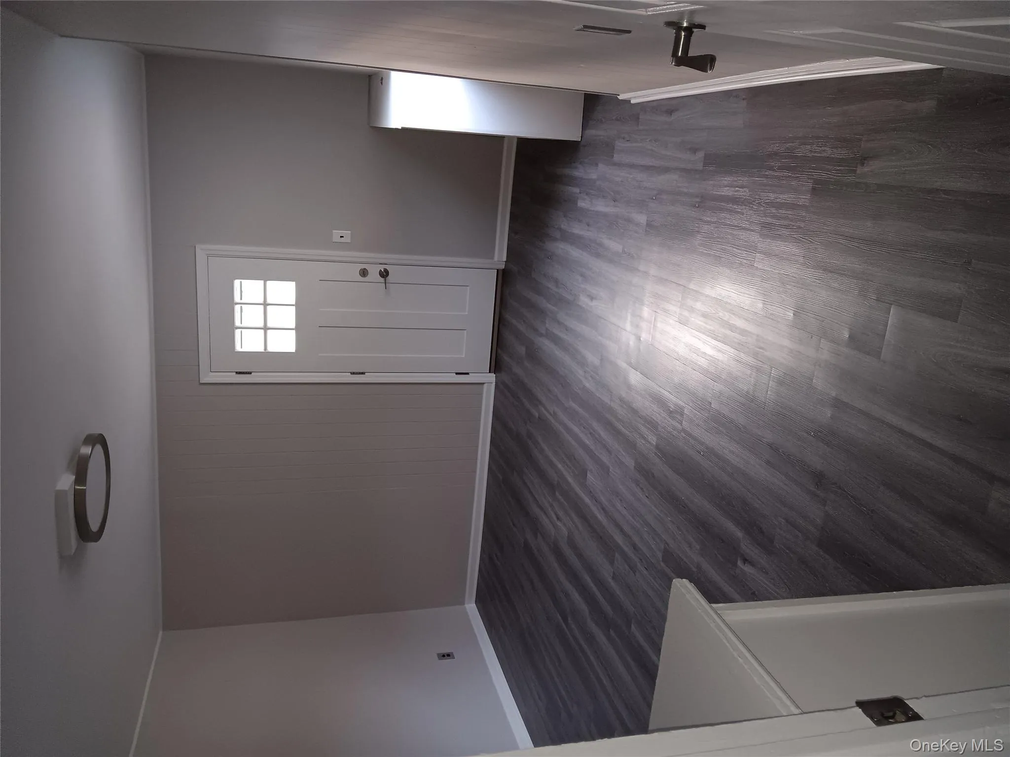 Foyer entrance featuring baseboards and dark wood finished floors Foyer entrance featuring baseboards and dark wood finished floors