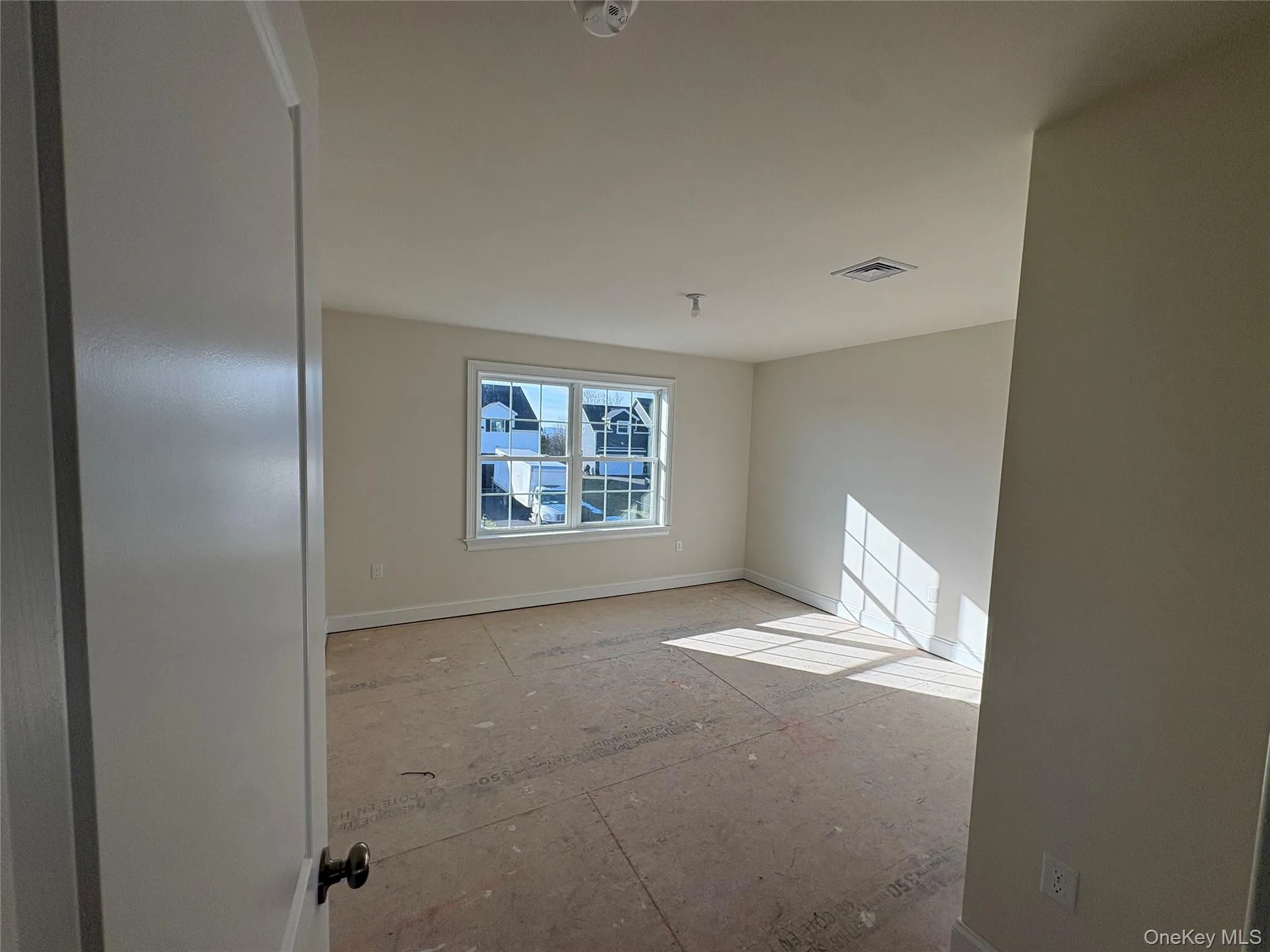 Empty room with baseboards Empty room with baseboards
