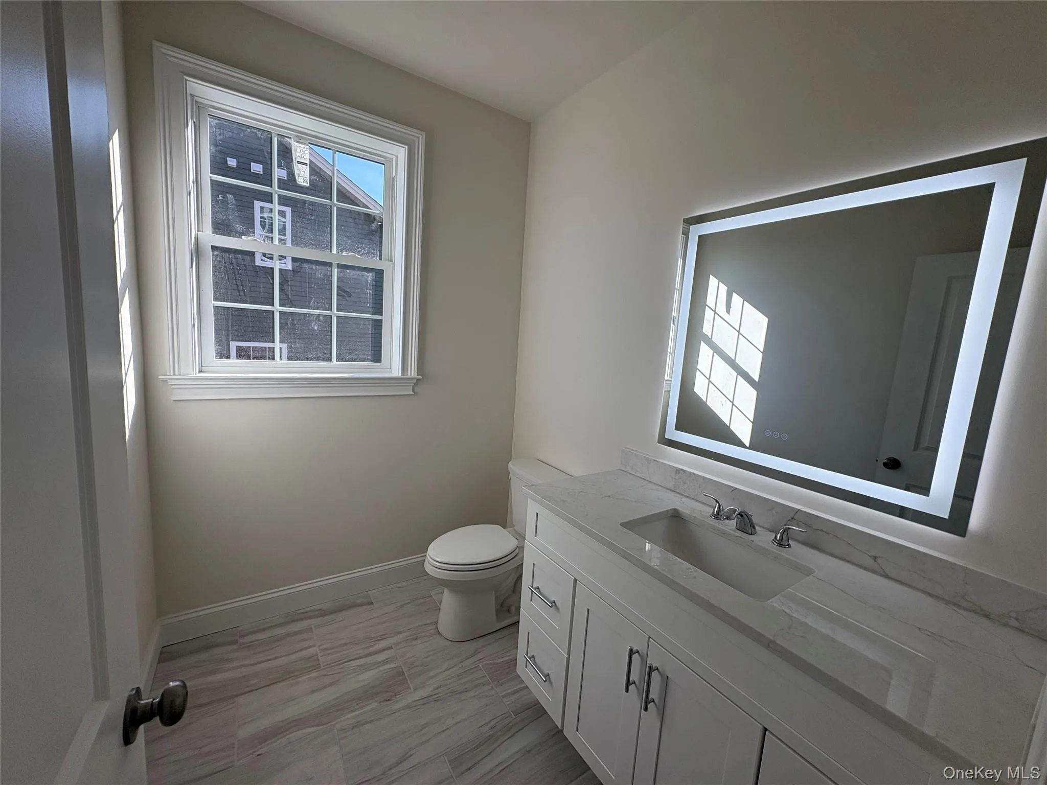 Bathroom featuring vanity and toilet Bathroom featuring vanity and toilet
